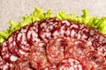 Thinly sliced salami slices close-up. Royalty Free Stock Photo