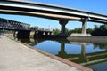 Old railroad bridge under an Autobahn bridge, both reflected in the Mosel Royalty Free Stock Photo