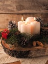 Third Advent candle burning, traditional Christmas decoration Royalty Free Stock Photo