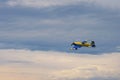 Third AirFestival at Chaika airfield. Small plane flies in storm clouds