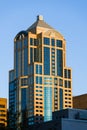 1201 Third Avenue Tower in Seattle rising above the surrounding buildings at dawn