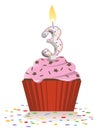 Third birthday cupcake with lit candle in shape of number three Royalty Free Stock Photo