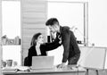 A thirst for romance. Couple of young coworkers conducting office romance. Workplace romance of handsome man and sexy Royalty Free Stock Photo