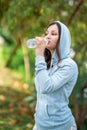Thirsty woman drinking water after sport activities.Health concept. Royalty Free Stock Photo