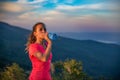 Thirsty woman trail runner drinking water from water bottle. Royalty Free Stock Photo