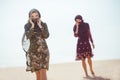 Thirsty women walking in a desert. Lost during the travel Royalty Free Stock Photo