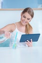 Thirsty young woman pouring a glass of water Royalty Free Stock Photo