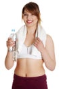 Thirsty young women drinking water after fitness