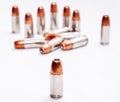 Thirteen hollow point 9mm bullets isolated on a white background Royalty Free Stock Photo