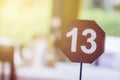 13 - thirteen, the number of the table in the restaurant. unlucky or lucky number, blur soft focus Royalty Free Stock Photo