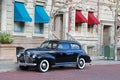 Thirties sedan parked in New York style neighborhood