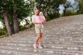 Thirty-year-old woman and little girl in full growth summer Royalty Free Stock Photo