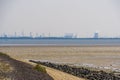 Tholen beach with view on the industrial zone, Bergse diepsluis, Oosterschelde, Zeeland, The Netherlands