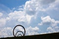 Thomas Sayre`s `Gyre` sculpture silhouetted against dramatic clouds