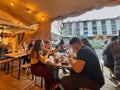 people sitting around table eating and drinking Royalty Free Stock Photo