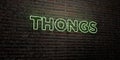 THONGS -Realistic Neon Sign on Brick Wall background - 3D rendered royalty free stock image