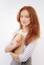 Red-haired woman touching chin with tip of pencil Royalty Free Stock Photo