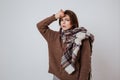 Thoughful woman in sweater and scarf Royalty Free Stock Photo