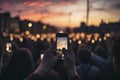 Digital Disconnect: Crowd Obsessed with Smartphones at Sunset