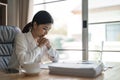 Thoughtful anxious asian business woman looking away thinking solving problem at work, worried serious young woman Royalty Free Stock Photo