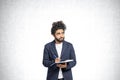 Thoughtful Arabic college student man portrait with notebook and pen, concrete Royalty Free Stock Photo