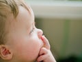 Thoughtful baby boy thinking about copyspace Royalty Free Stock Photo
