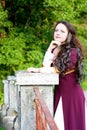 Thoughtful beautiful woman in medieval suit