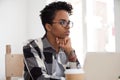Thoughtful black female look in distance making decision Royalty Free Stock Photo