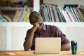 Thoughtful black worker dreaming about future achievements Royalty Free Stock Photo