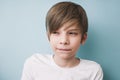 Thoughtful boy with bitter prank bitten his lower lip with his t Royalty Free Stock Photo