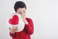 Thoughtful boy with a heart Royalty Free Stock Photo