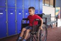 Thoughtful boy sitting on wheelchair Royalty Free Stock Photo