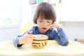 Thoughtful boy (2.11 years) eats soup Royalty Free Stock Photo