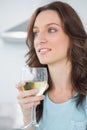 Thoughtful brunette drinking white wine Royalty Free Stock Photo