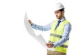 Thoughtful builder in reflective vest looking at blueprint
