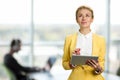 Thoughtful business lady with digital tablet. Royalty Free Stock Photo