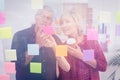 Thoughtful business team looking at a post it Royalty Free Stock Photo