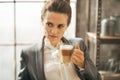 Thoughtful business woman drinking coffee Royalty Free Stock Photo