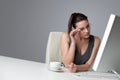Thoughtful business woman at office with coffee Royalty Free Stock Photo