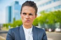 Thoughtful business woman in office district Royalty Free Stock Photo