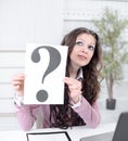 Thoughtful business woman showing a question mark Royalty Free Stock Photo