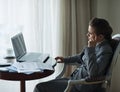 Thoughtful business woman working at hotel room Royalty Free Stock Photo