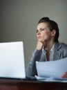 Thoughtful business woman working at hotel room Royalty Free Stock Photo