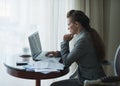 Thoughtful business woman working in hotel room Royalty Free Stock Photo