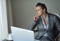 Thoughtful business woman working on laptop Royalty Free Stock Photo