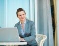 Thoughtful business woman working on laptop Royalty Free Stock Photo