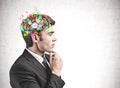 Thoughtful businessman and cog brain Royalty Free Stock Photo