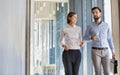 Business people walking in office corridor Royalty Free Stock Photo