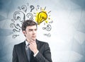 Thoughtful businessman and his bright idea Royalty Free Stock Photo