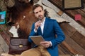 Thoughtful businessman holding his tablet and looking away Royalty Free Stock Photo
